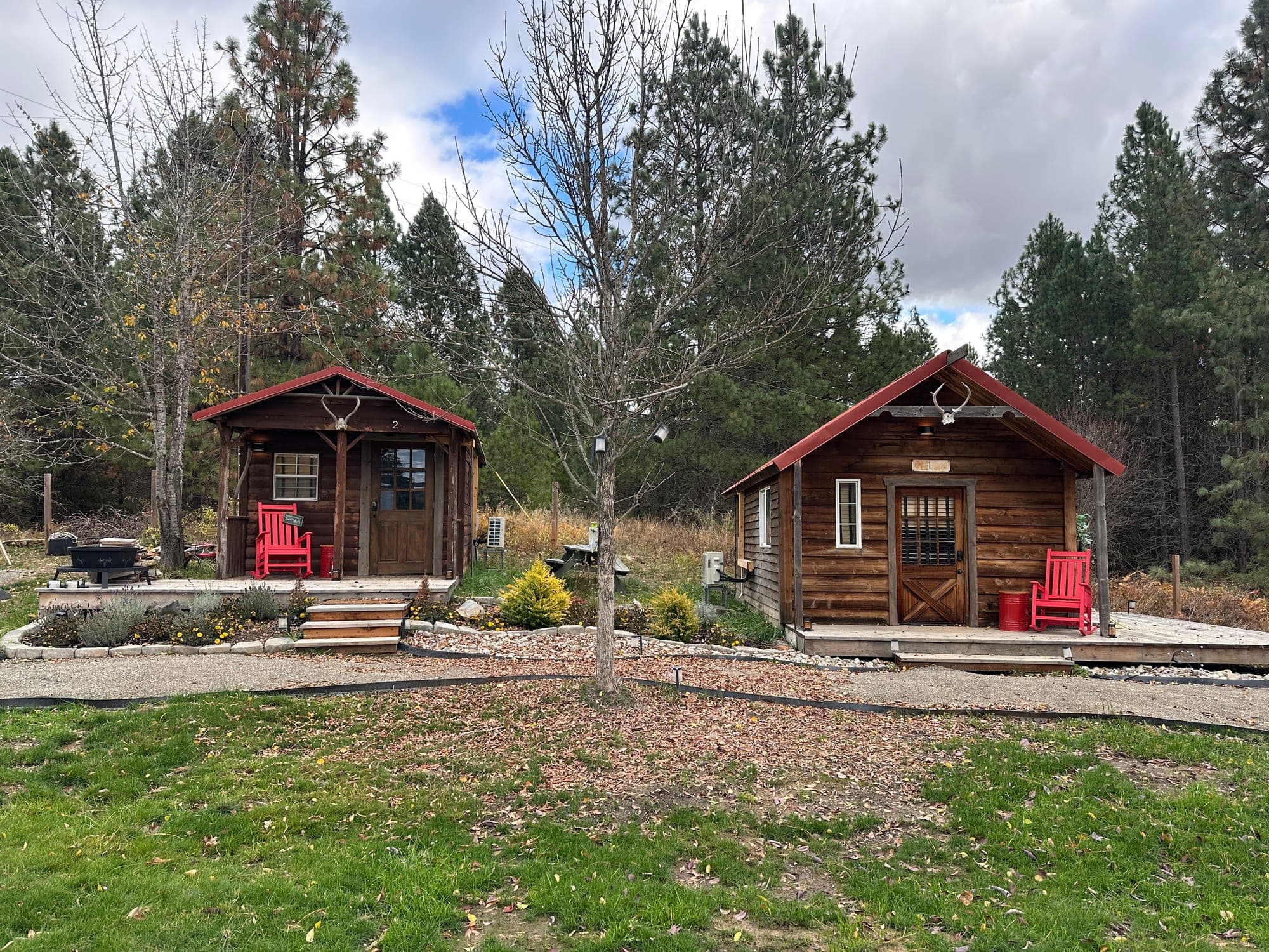 Izzy's and Pop's Log Cabins in autumn at Watson's Lakefront Resort, near the Trail of the Coeur d'Alenes