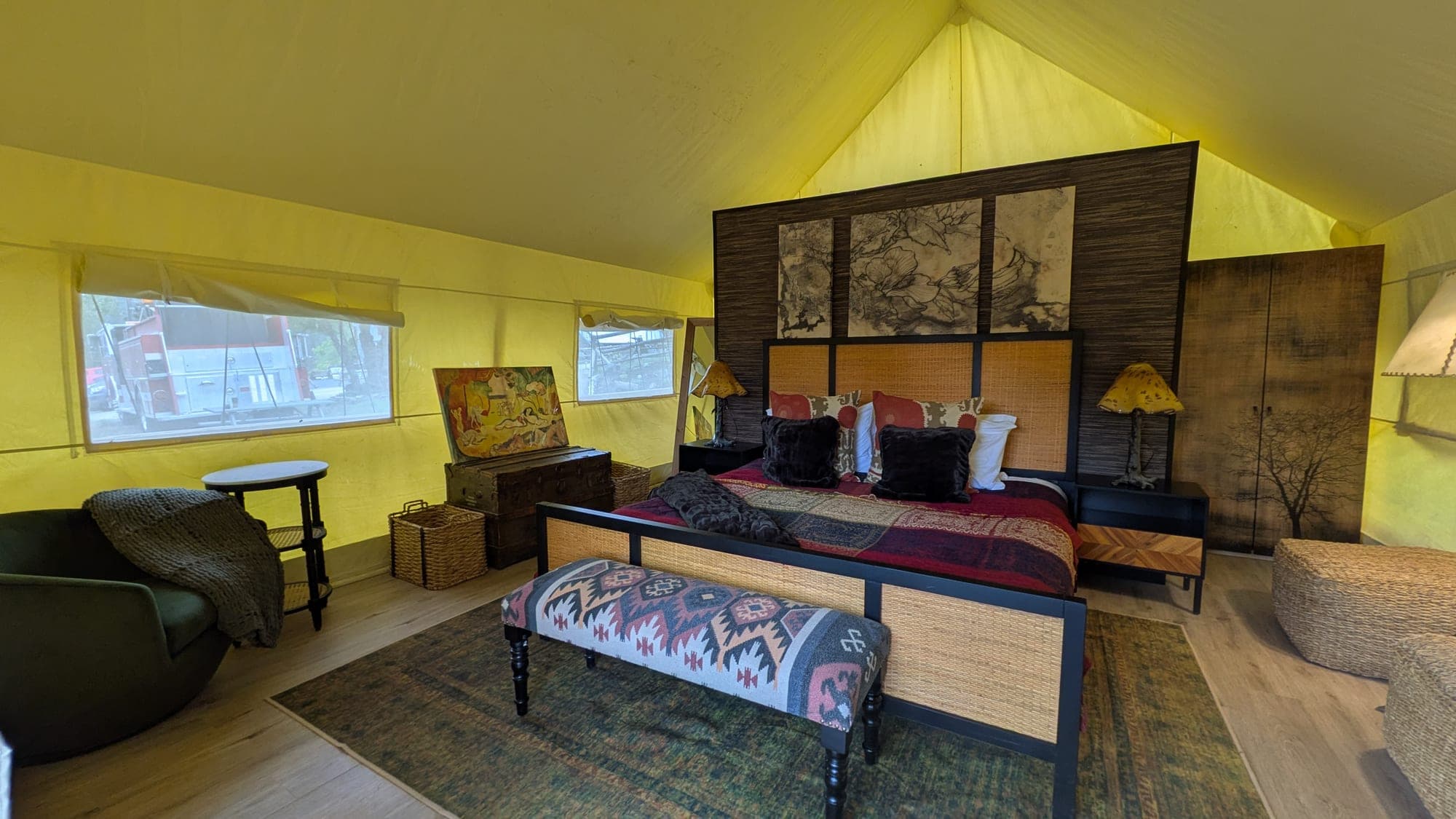Safari Tent interior with a canopy bed under canvas walls