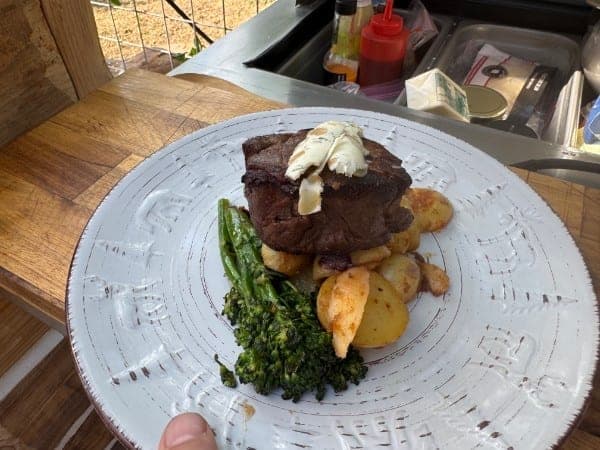 Grilled hand-cut steak with charred broccolini at Red's Tavern