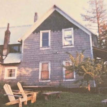 Sepia-toned archival photograph of the lodge building at Watson's with Adirondack chairs out front
